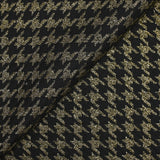 Gold houndstooth wool blend tweed on black background