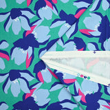 Cotton elastane satin blue flowers mint green background