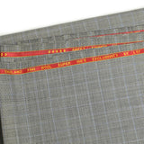 100% Prince of Wales wool suit fabric, black, blue, off-white background