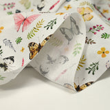 Coton imprimé papillons multicolore fond blanc
