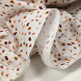 Cotton printed according to the brown wind white background