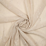 Voile de polyester brodé fleurs et feuillages beige