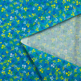 Cotton poplin printed yellow and blue bud with turquoise background