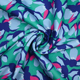 Cotton elastane satin blue flowers mint green background