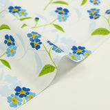 Cotton poplin printed blue flower and green stem sky background