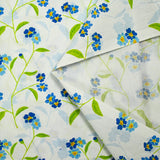 Cotton poplin printed blue flower and green stem sky background