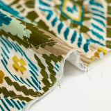 Double-sided quilted viscose ikat and green and ocher cashmere by the meter