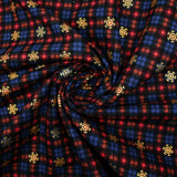 Cotton flannel printed with brown tartan and gold flakes
