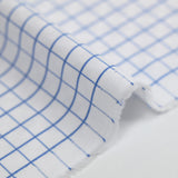 Polycotton poplin jacquard with denim blue checks and white background