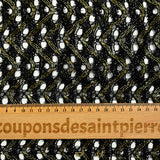 Puntilla de poliéster calada con ondas de lúrex dorado y negro