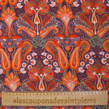 Cotton corduroy with orange paisley print and purple background