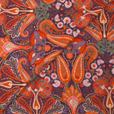 Cotton corduroy with orange paisley print and purple background