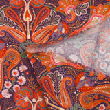 Cotton corduroy with orange paisley print and purple background