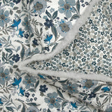 Coton matelassé double face Mayla fleurs bleu fond blanc au mètre