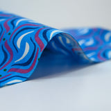 Cotton wave print fuchsia blue background