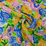 Viscose printed mountain of orange, blue and green flowers