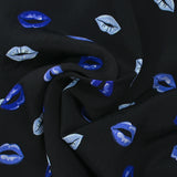 Viscose crepe printed with blue mouth and black background