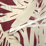 Cotton voile printed with traces of leaves, burgundy background