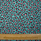 Pink leopard print cotton with turquoise background