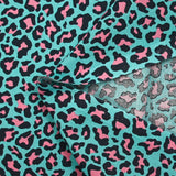 Pink leopard print cotton with turquoise background