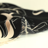 Fine crepe with burst of flowers print on black background