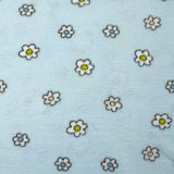 Polaire doudou imprimée fleurs et canetons fond bleu ciel