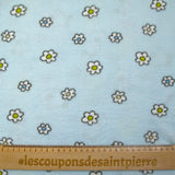 Polaire doudou imprimée fleurs et canetons fond bleu ciel