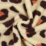 Piel sherpa sintética de leopardo fondo salmón y ciruela crudo