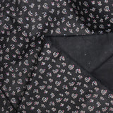 Polycotton poplin printed with flowers on black background