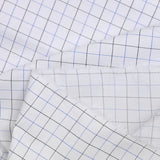 Dyed-woven polycotton poplin dotted black and blue with white background