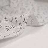 Striped printed polycotton poplin and branches gray background
