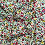 Flores de aurora estampada de algodón de fondo blanco rojo y amarillo por metro