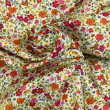 Coton imprimé Greta fleurs fuchsia et orange fond blanc au mètre