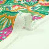 Ginevra pink and orange print cotton green background per meter