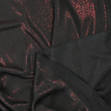 Fine red Lurex knit with black background