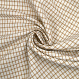 Polyester elastane with camel checkered off-white background