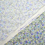 Coton imprimé Giorgia fleurs violet et bleu fond écru au mètre