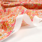 Coton imprimé Matilde fleurs mandarine et rose au mètre