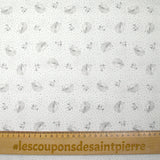 Cotton piqué with hedgehog print and blue polka dots on white background