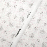 Cotton piqué with hedgehog print and pink polka dots on white background