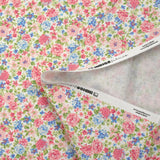 Cotton piqué printed with Sarah's flowers in blue and strawberry on a white background