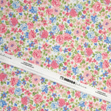 Cotton piqué printed with Sarah's flowers in blue and strawberry on a white background