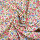 Cotton piqué printed with Sarah's flowers in blue and strawberry on a white background