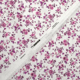 Cotton piqué printed with purple Louna flowers on white background