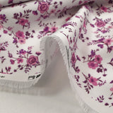 Cotton piqué printed with purple Louna flowers on white background