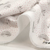 Cotton piqué with hedgehog print and pink polka dots on white background