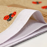 Polycoton imprimé coccinelle fond ficelle