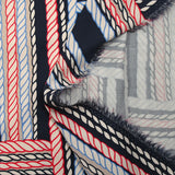 Viscose satin printed with blue and red ropes, navy background