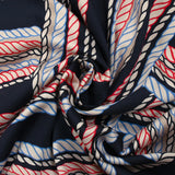 Viscose satin printed with blue and red ropes, navy background
