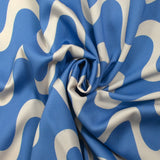 Viscose satin printed with ecru waves and sky background